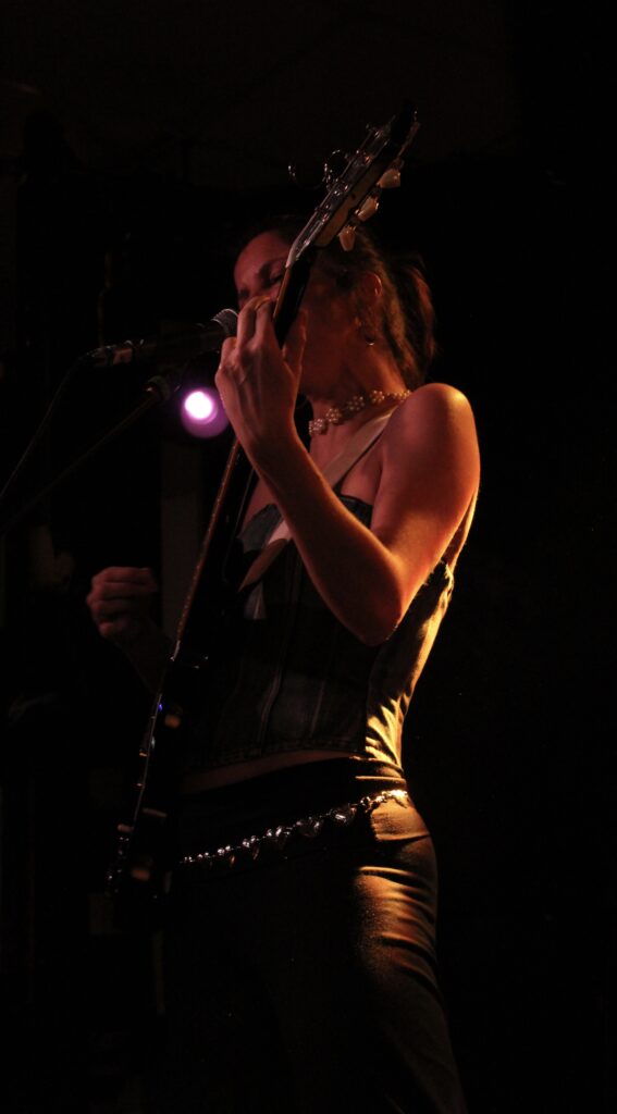 Carlotta Cosials, lead singer of Hinds, performing onstage at The Brudenell Social Club.