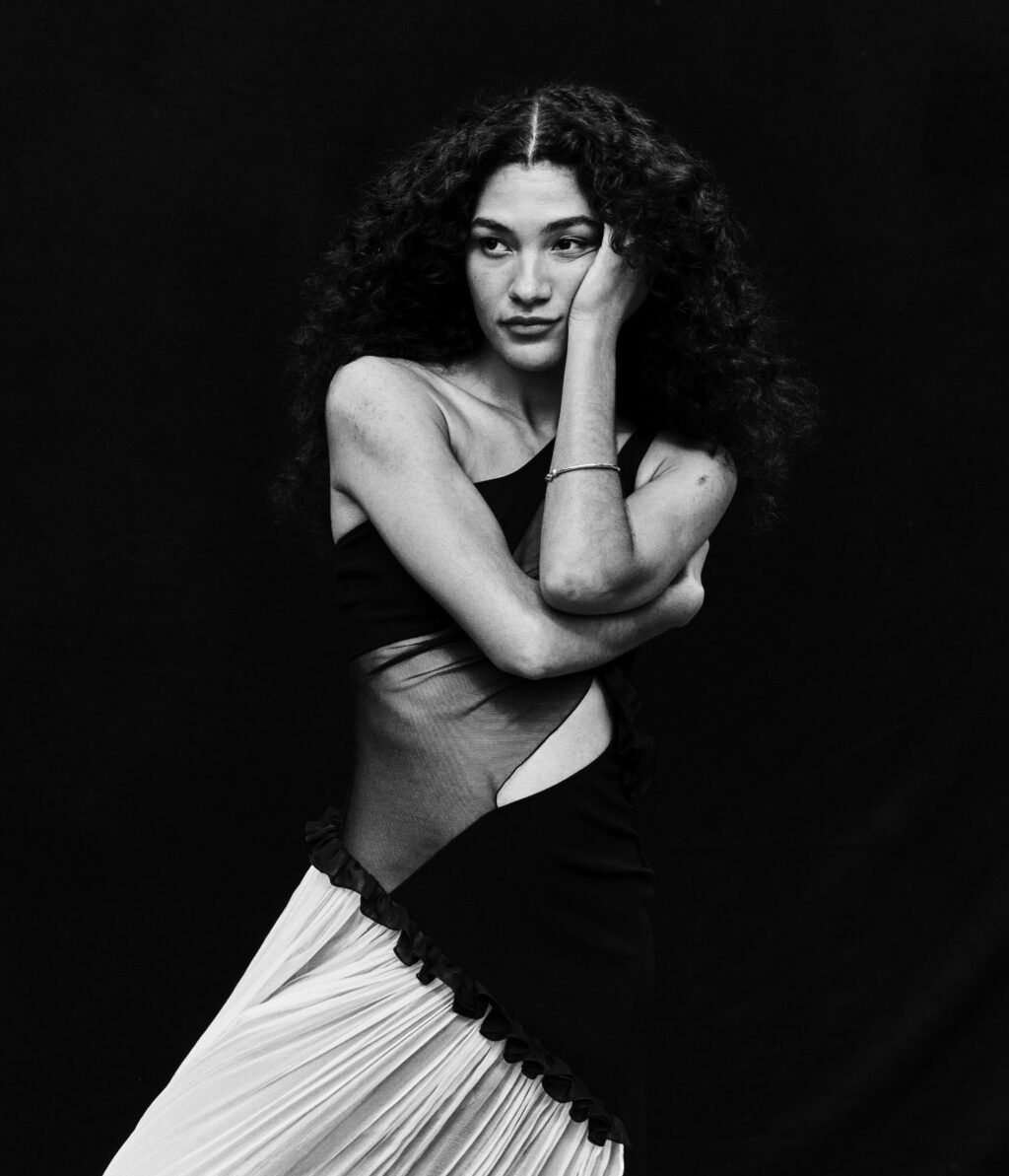 Olivia Dean, pictured in black and white