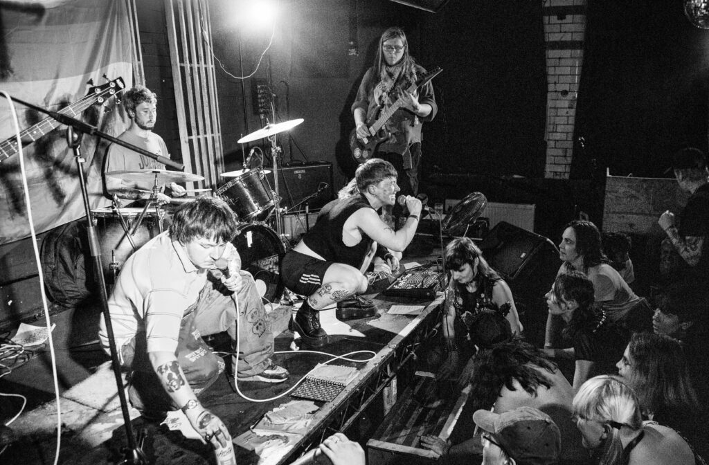 A band at Rat Mode Festival performs to an energetic crowd