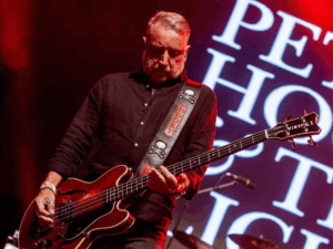 Peter Hook plays bass on stage as part of 'Peter Hook & The Light'