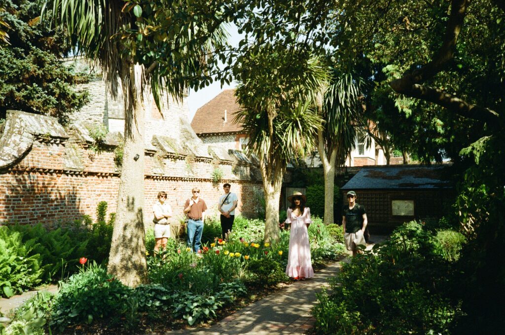 Leeds band Gladboy pose for a photo surrounded by shrubery
