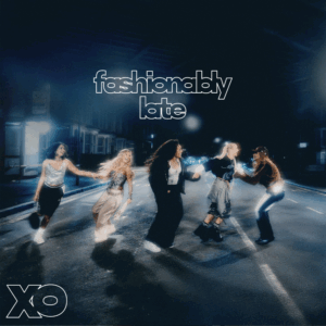 EP artwork for XO's debut EP 'Fashionably Late' (2025). It features the 5 members of the pop-group on a road late at night, they are all dressed up, looks like they are rushing off to a night out - all dancing together.