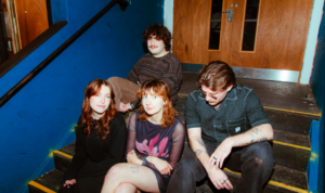 Eszter Vida and her band pose for a photo backstage
